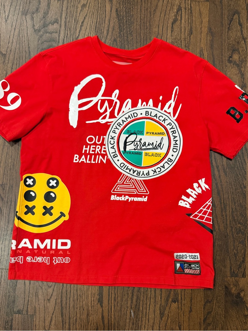 Black Pyramid Red Graphic Short Sleeve Tee with Yellow Smiley
